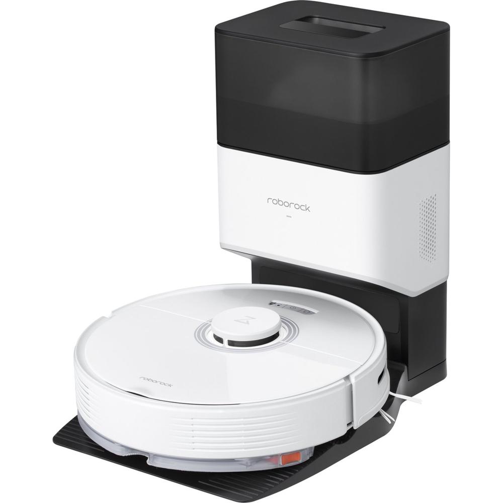 Een beeld van een Roborock robotstofzuiger met een oplaadstation. De stofzuiger is wit met een ronde vorm en staat op een zwart, plat oppervlak naast het zwarte en witte oplaadstation.