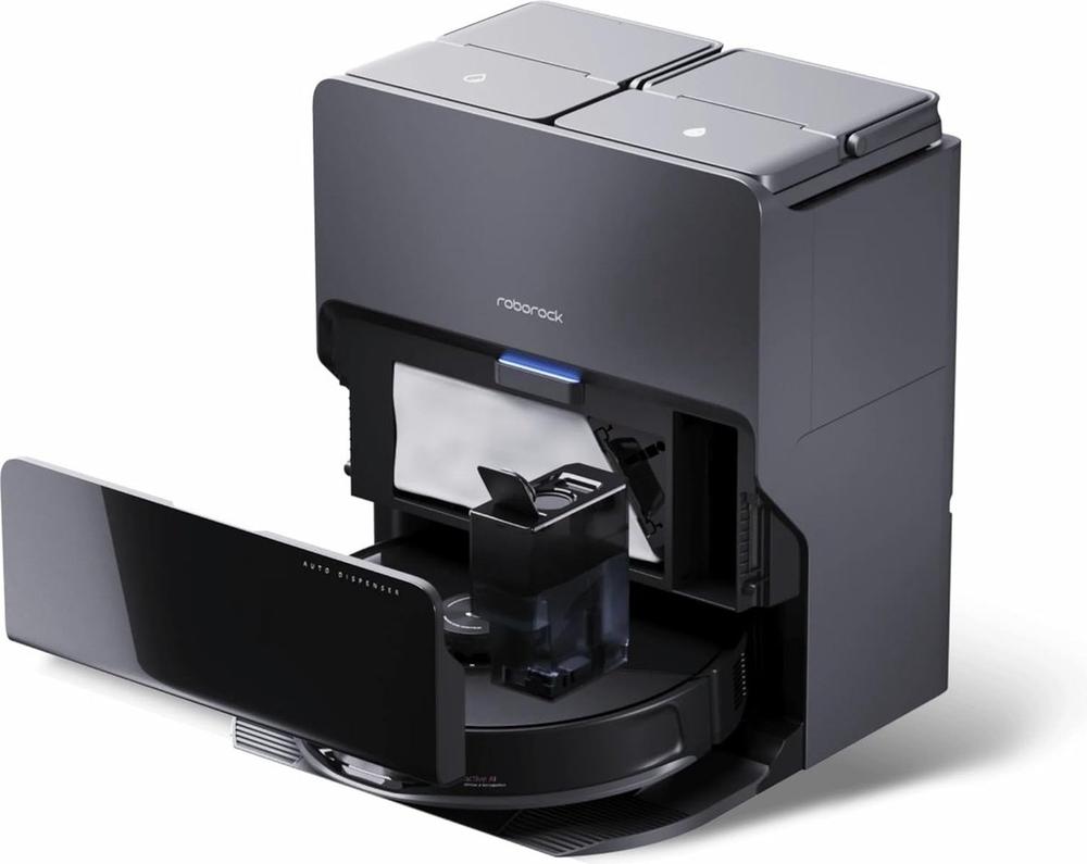 Een moderne robotstofzuiger met een automatisch vulstation, dat zijn functie benadrukt door een geavanceerd ontwerp in zwart met een glanzende afwerking. De afbeelding toont de open la waarin de stofzuiger zijn afval verzamelt, met zichtbaar waterreservoir en een opbergruimte voor accessoires.